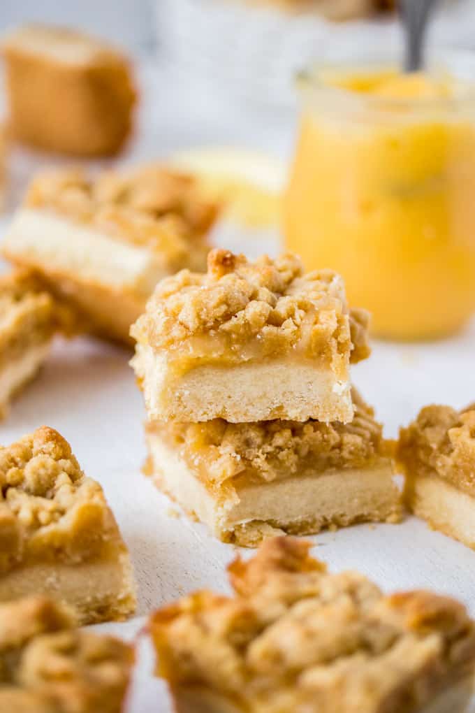 A stack of Lemon Crumble Slices with more surrounding it.