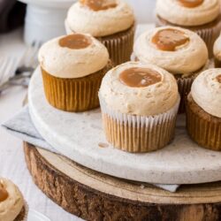 A view of 9 cinnamon cupcakes on a plate