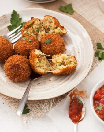 These Chorizo Arancini are little handfuls of spanish inspired risotto, that are then coated in breadcrumbs and deep fried to golden perfection.