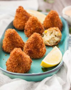 These Sweet Corn Arancini are little handfuls of risotto, that are then coated in breadcrumbs and deep fried to golden perfection. Completely vegetarian too!