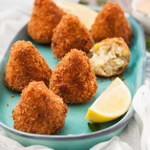 These Sweet Corn Arancini are little handfuls of risotto, that are then coated in breadcrumbs and deep fried to golden perfection. Completely vegetarian too!