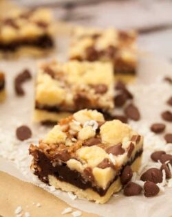 Chocolate Caramel Coconut Bars are shortbread, chocolate brownie, homemade caramel, coconut and choc chips. Yum!