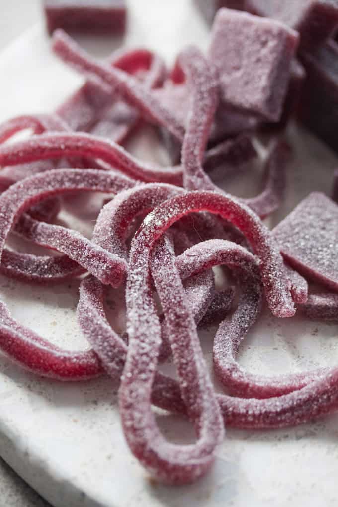 Close up of cherry gummy strings.