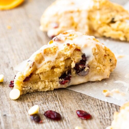 a cranberry scone on a wooden board