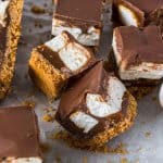 Caramel Chocolate Marshmallow Cookie Bars – it may be a long name but these no bake cookie bars, filled with marshmallow, chewy caramel and covered in chocolate deserve it. #sugarsaltmagic #caramel #marshmallow #nobakerecipes #cookiebars #nobake #caramelrecipes #foodgifts