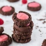 These scrumptious Chocolate Raspberry Thumbprint Cookies start with a simple chocolate cookie dough baked and filled with a jewel centre of raspberry ganache. #sugarsaltmagic #cookies #cookierecipes #thumbprintcookies #chocolatecookies #chocolateraspberry #raspberryganache #ganache #foodgifts #christmasfoodgifts #christmascookies #chocolate