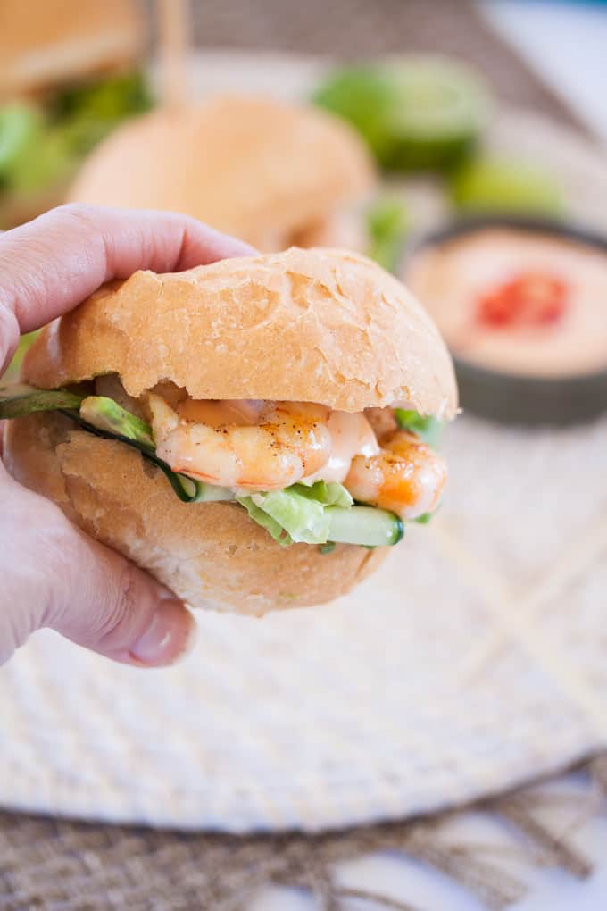 Prawn Sliders with Sriracha Mayonnaise make the perfect party food. Perfect grilled, lightly spiced prawns fill these little rolls, topped with a spicy mayo. #prawnrolls #sliders