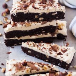 These Chocolate Hazelnut Brownies are dense, moist chocolate brownies, filled with hazelnuts and smothered in a layer of amazing hazelnut buttercream.