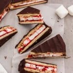 This Giant Homemade Wagon Wheel Biscuit is just like the wagon wheels you grew up with but bigger. A delicious combination of biscuit, marshmallow and raspberry jam all smothered in dark chocolate.