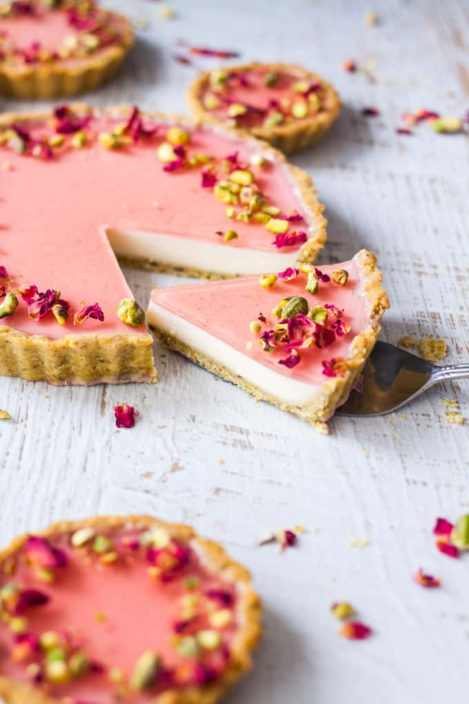 Pistachio Rose Panna Cotta Tart, with it’s pistachio tart crust, rose panna cotta filling and rose jelly topping is a beautiful tart just perfect for a special occasion.