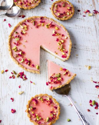 Pistachio Rose Panna Cotta Tart, with it’s pistachio tart crust, rose panna cotta filling and rose jelly topping is a beautiful tart just perfect for a special occasion.