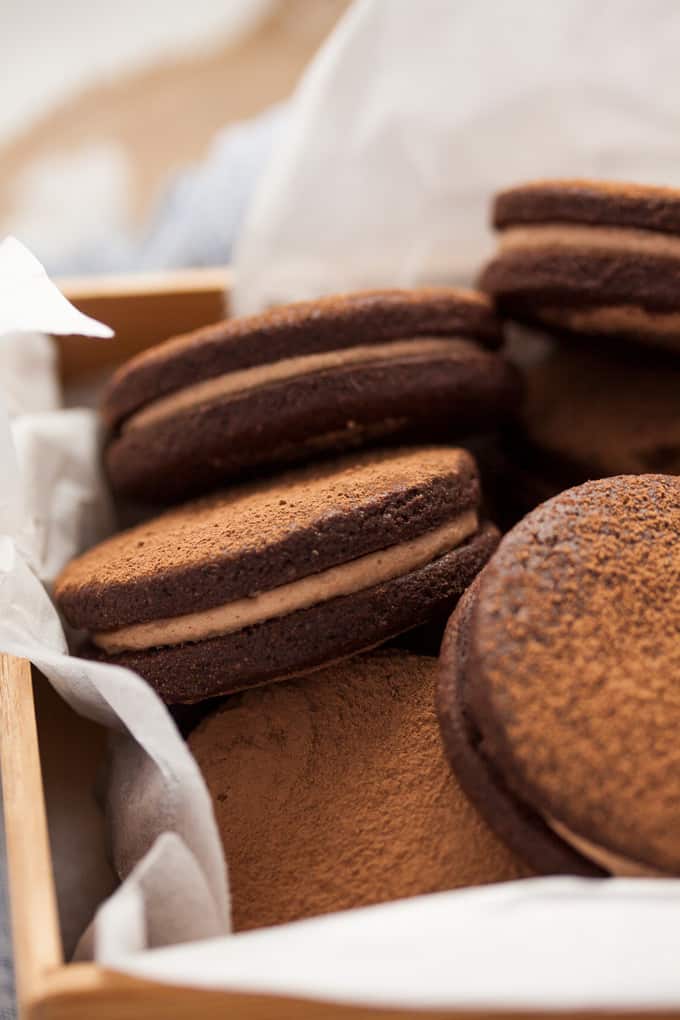 A batch of nutella sandwich cookies in a gift box.