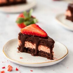 These Strawberry and Chocolate Petit Fours are easy to make chocolate cake filled with strawberry buttercream and topped with chocolate ganache. A cute sweet treat for Mother’s Day, a birthday or afternoon tea.