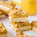 This Lemon Crumble Slice is zesty and bright and one of the most delicious lemon curd desserts. With a shortbread base and crunchy crumble topping, this lemon slice is easy to make too. #sugarsaltmagic #lemonrecipes #lemonbars #lemoncrumble