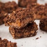 Caramel Chocolate Carmelita Bars (or Chocolate Carmelitas for short) and a superb combination of chocolate chips and easy caramel sandwiched in chocolate oatmeal cookie.