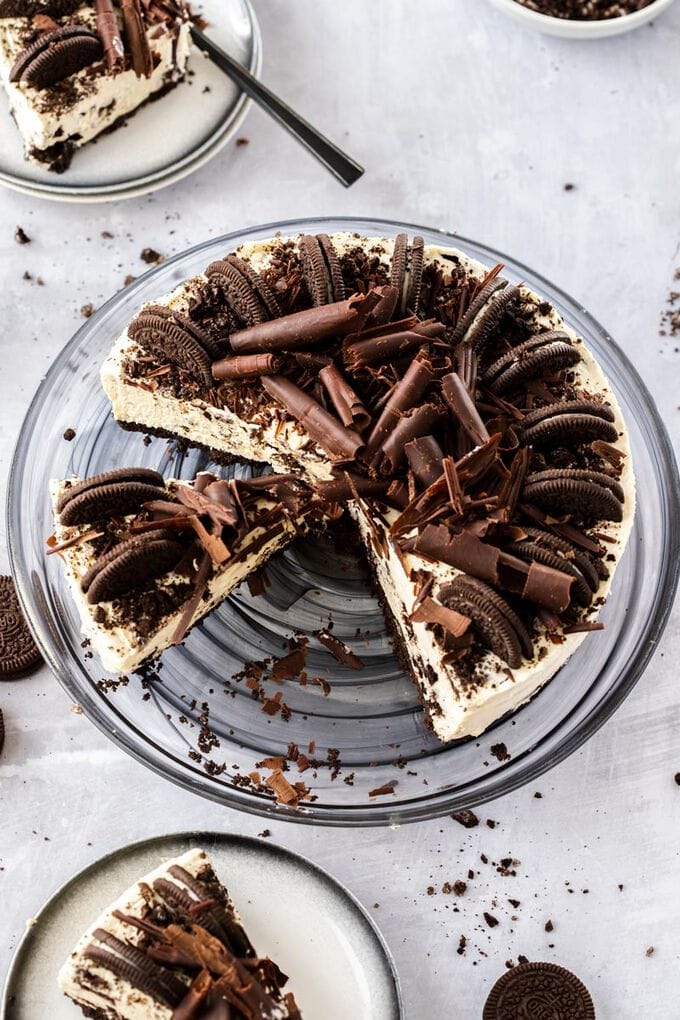 Birdseye view of an oreo cheesecake with a few slices cut out.