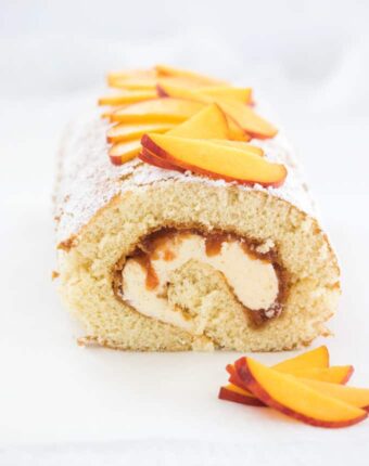 This beautiful Peaches and Cream Swiss Roll Cake Recipe is easy peach jam and the smoothest creamy frosting, all rolled up in a delicate swiss roll. If you’re looking for peach desserts, this is the one you need.