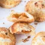 These Spiced Peach Hand Pies are a combination of fresh peaches, a kick of cinnamon and ginger, all wrapped up in the perfect buttery pie crust. These mini pies perfect portable dessert.