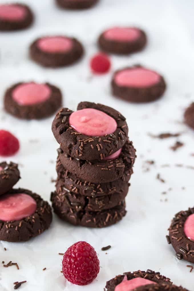 A stack of 5 Chocolate Raspberry Thumbprint Cookies.