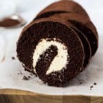 A light ChocolateRoll Cake filled with a whipped vanilla buttercream frosting is just the perfect afternoon tea treat or dessert. Get my tips on how to make the perfect roll cake. #sugarsaltmagic #swissroll #spongeroll #chocolatecake #chocolaterecipes #chocolatedesserts #cakeroll #rollcake #swissrollcake