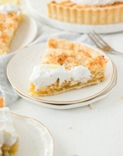 This gorgeous Lemon Coconut Frangipane Tart is a perfect coconut and almond frangipane filling on top of vegan lemon curd and inside a vegan tart shell. That's right, this lemon tart just happens to be vegan.