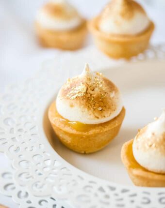 Mini Lemon Meringue Pies are the classic Lemon Meringue Pie in miniature. The perfect sweet finger food recipe that can be assembled at the last minute.