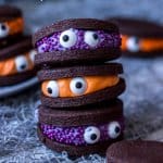 Looking for easy Halloween treats? How about my Chocolate Monster Halloween Cookies? Super cute, fun and easy to make chocolate sandwich cookies with coloured vanilla buttercream filling.