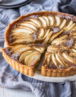 Sweet apples encased in an easy almond pastry filling and a crisp tart shell, this Apple Frangipane Tart is equal parts flavourful and delicate. If you’re looking for easy apple desserts, you’ve found one.