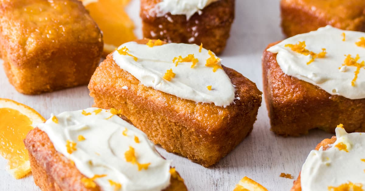 Closeup of Mini Flourless Ginger Orange Cakes on a white board.