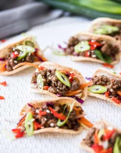 A batch of mini tacos filled with beef mince.