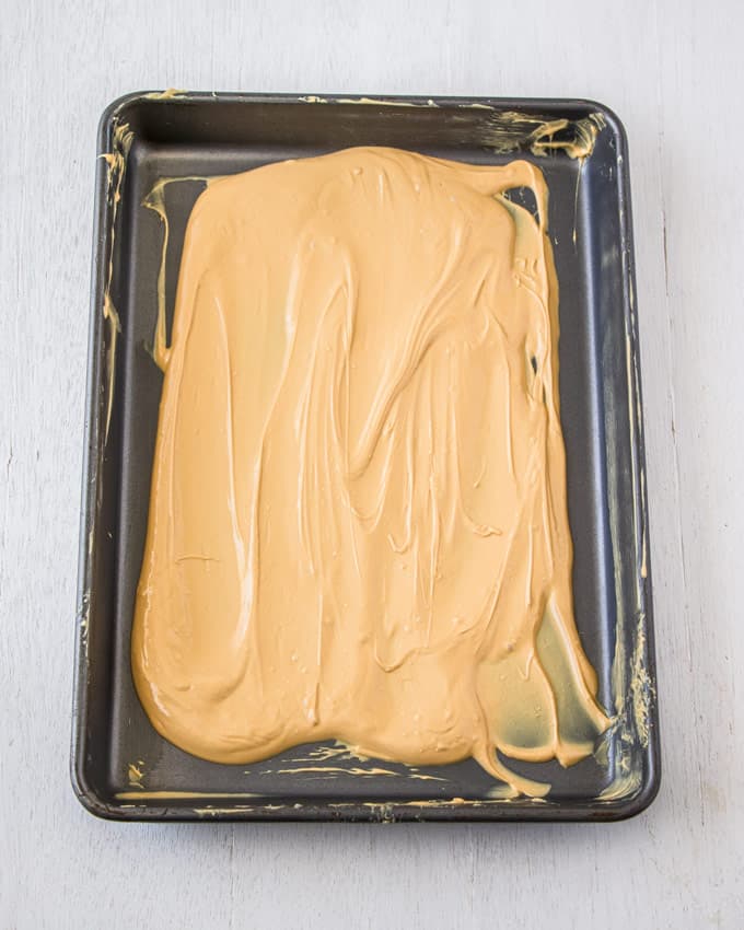 A baking tin covered in caramelised white chocolate.