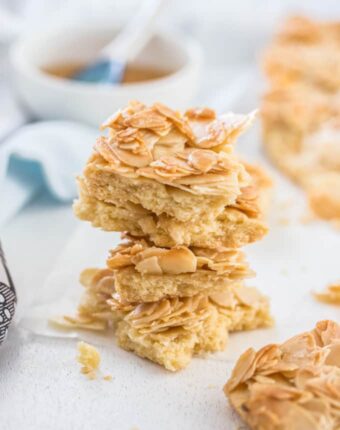 This Honey Almond Slice is an easy shortbread base topped with flaked almonds that have been mixed with a honey butter mixture. It bakes up crispy and chewy and will leave you wanting more.