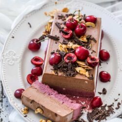 This Frozen Cherry Chocolate Parfait recipe is a layered no churn ice cream parfait. Layers of cherry ice cream and chocolate ice cream, combine into a smooth and creamy, easy dessert.