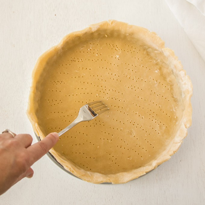 Docking tart dough with a fork
