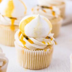 These Passionfruit Coconut Cupcakes start with an easy coconut cupcake recipe, thats filled with passionfruit curd and topped with coconut buttercream. Total tropical vibes.