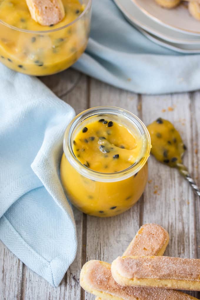 Top down view of a jar with passionfruit curd.