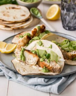These Easy Fish Tacos will become a family favourite. Pan fried fish tacos, dressed in a pumpkin seed pesto are flavourful and ready in under 30 minutes.
