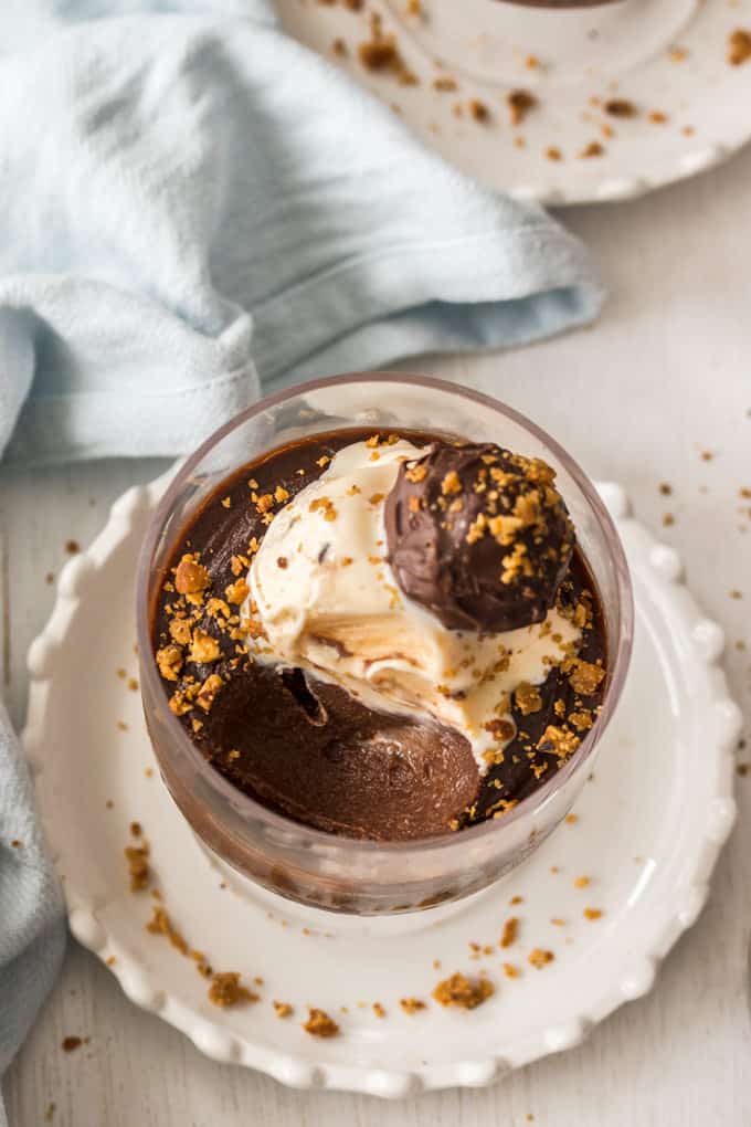 A Frangelico Chocolate Custard Pot on a white plate with a scoop taken out of it