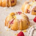 These Lemon Raspberry Mini Bundt Cakes are a simple lemon cake recipe, studded with fresh raspberries and topped with lemon icing, all baked in a mini bundt pan.