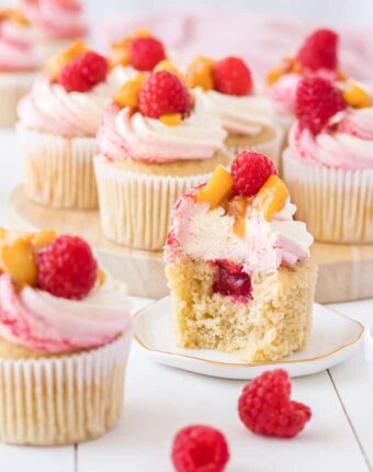 These Peach Melba Cupcakes are based on the classic Peach Melba dessert. Fabulous raspberry and peach cupcakes with a creamy vanilla frosting.