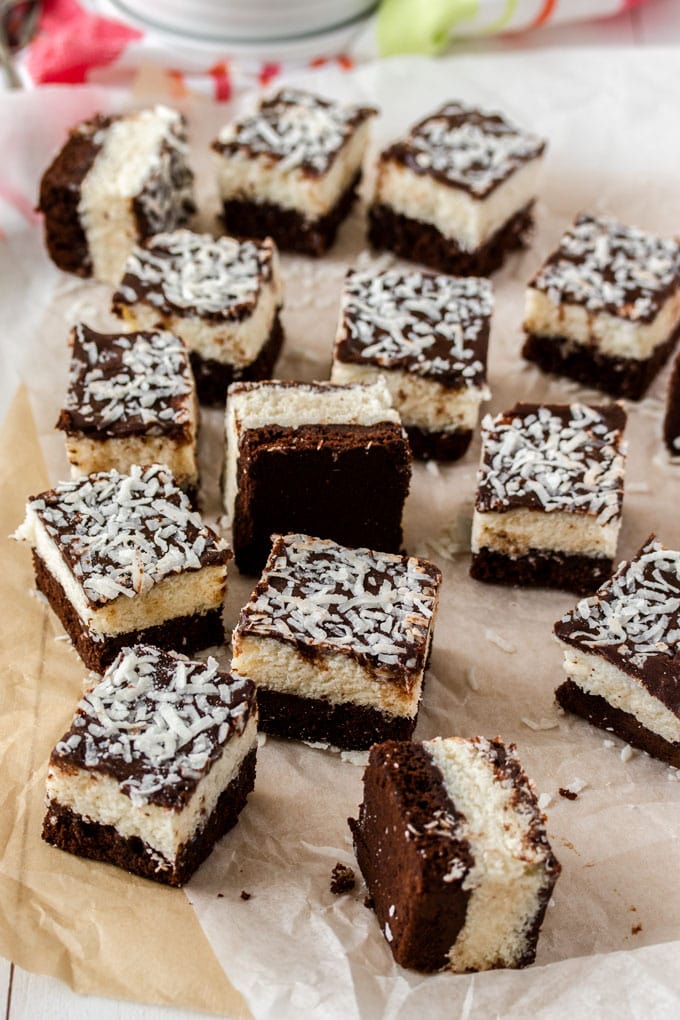 A group of chocolate coconut brownies on baking paper
