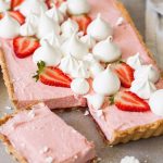 This Strawberry Mousse Tart is a soft silky real strawberry mousse, inside a crisp tart shell and topped with crispy meringue kisses. Such a beautiful Spring dessert. #sugarsaltmagic #strawberrymousse #mousse #strawberrytart
