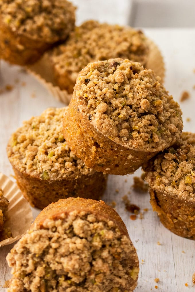 Closeup of stacked carrot cake muffins on a white board
