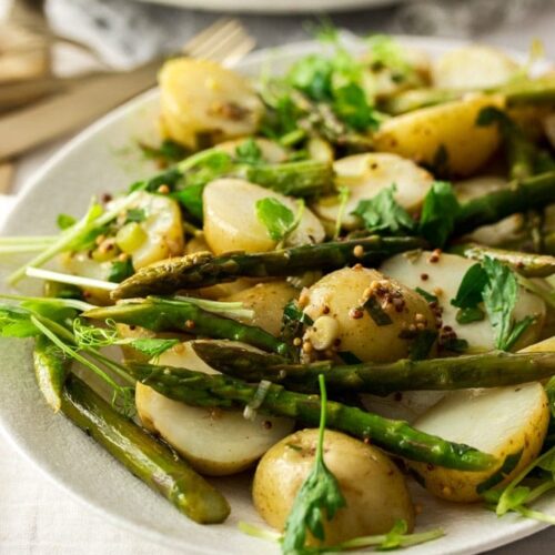 close up shot of warm potato asparagus salad