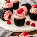 These Raspberry Chocolate Cupcakes are a classic flavour combination. Using my absolute favourite chocolate cupcake recipe (it's so easy) and a gorgeous, silky smooth raspberry frosting, you'll have a hard time stopping at one. #sugarsaltmagic #chocolatecupcakes #raspberrycupcakes #cupcakes
