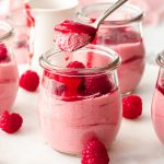 With just 10 minutes of effort, you can create this luscious, Easy Raspberry Mousse at home yourself. Just 5 simple ingredients, including frozen raspberries so you can have this melt in the mouth, eggless mousse any time of year.