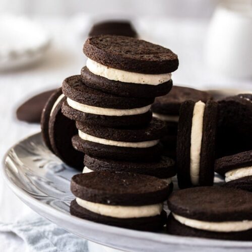 A stack of homemade oreo cookies on a grey plate