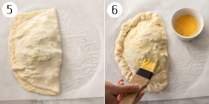 A folded calzone being brushed with beaten egg