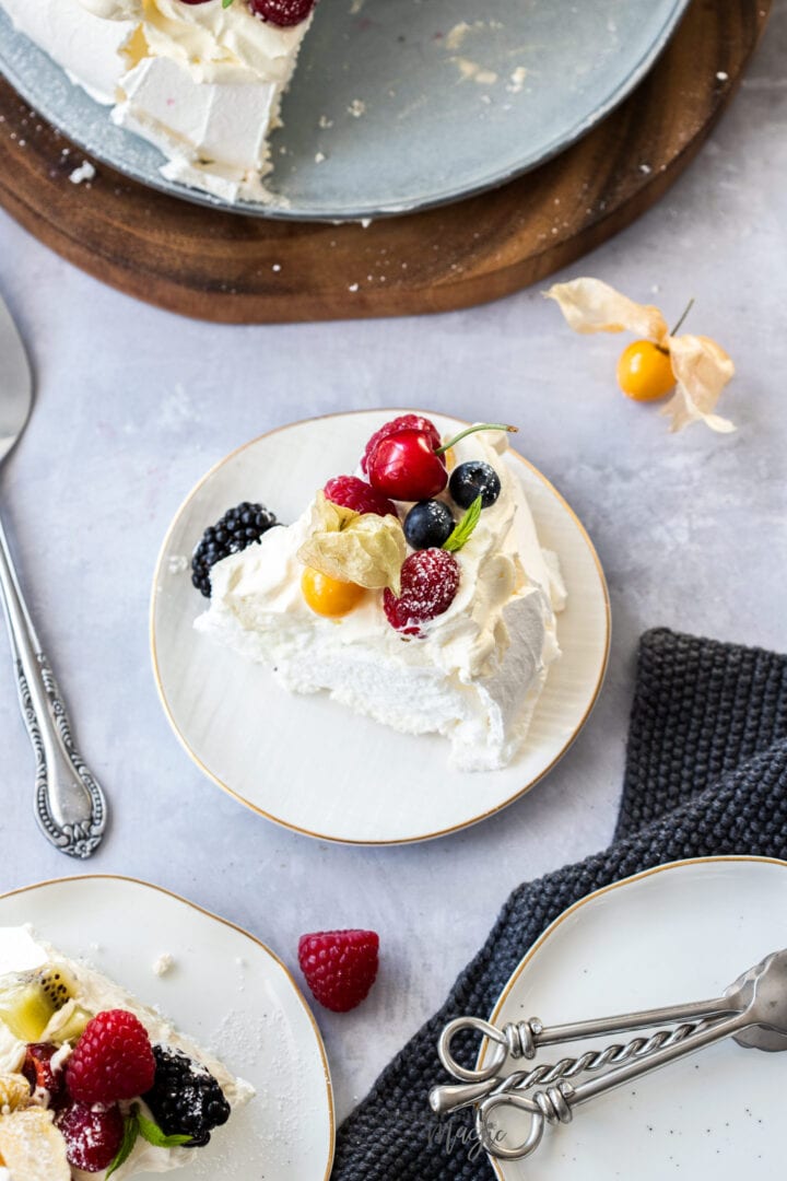 Birdseye view of a slice of pavlova topped with berries.