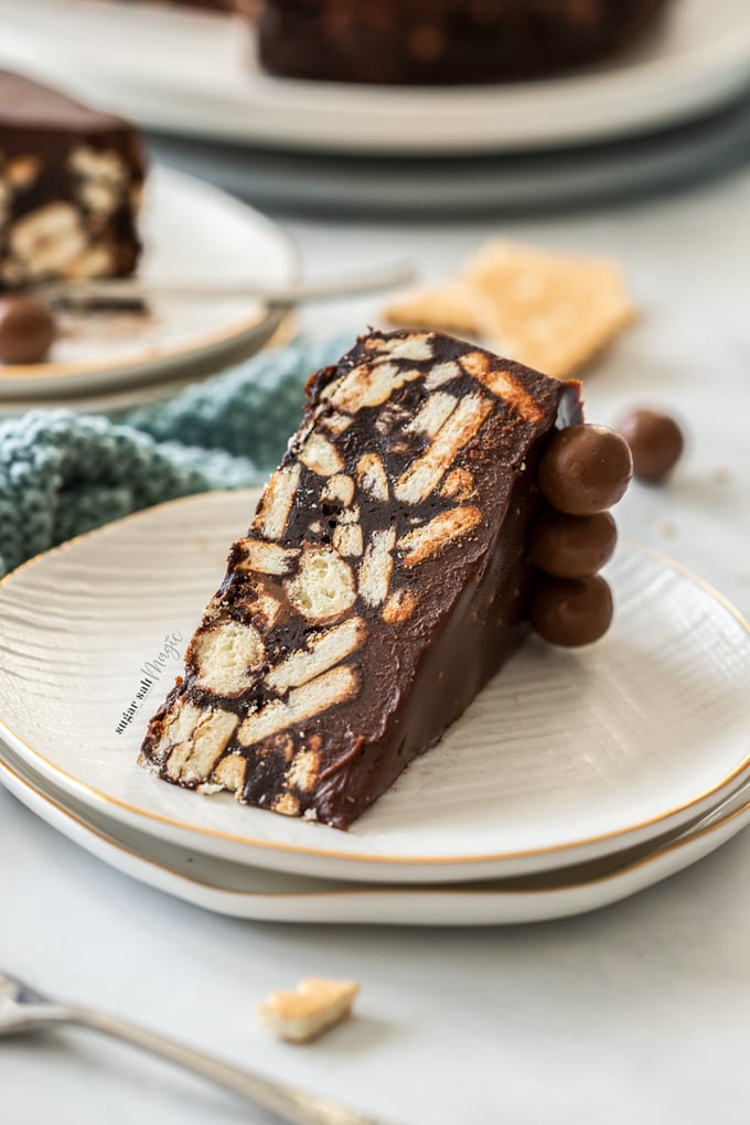 A slice of chocolate fridge cake on a dessert plate.